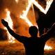 Members of the National Socialist Movement, one of the largest neo-Nazi groups in the US, hold a swastika burning after a rally on April 21, 2018 in Draketown, Georgia.